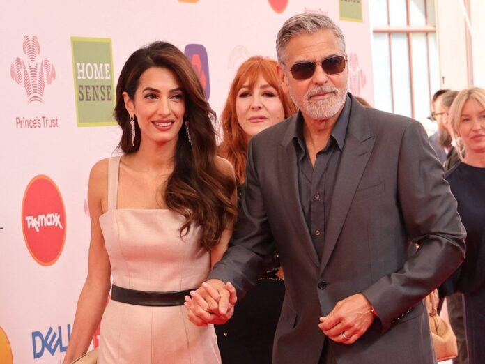 George und Amal Clooney zeigten sich händchenhaltend auf dem roten Teppich.