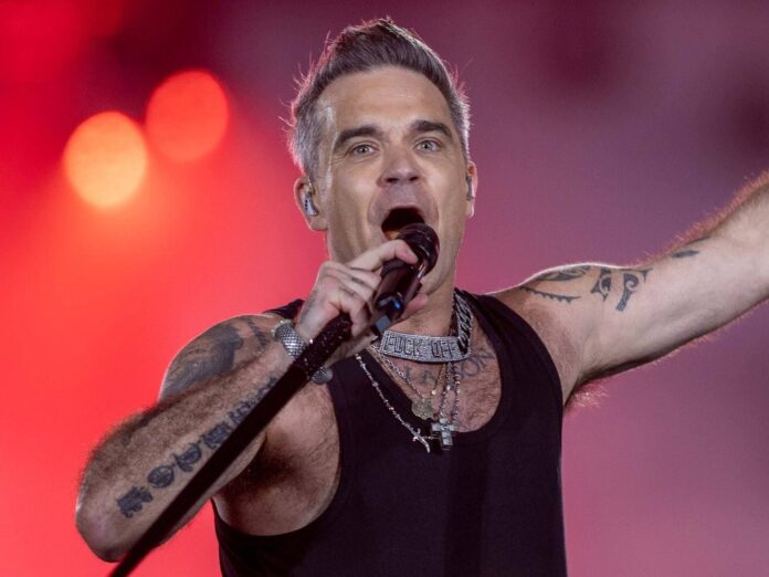 Robbie Williams bei einem Konzert in München.