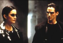 Schwarze Leder-Outfits und Sonnenbrillen: Carrie-Anne Moss und Keanu Reeves in "Matrix".